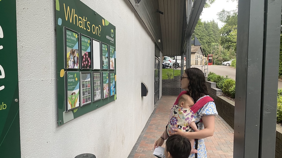Richard's wife and children checking out the 'What's on?' board at Whitemead Forest pARK